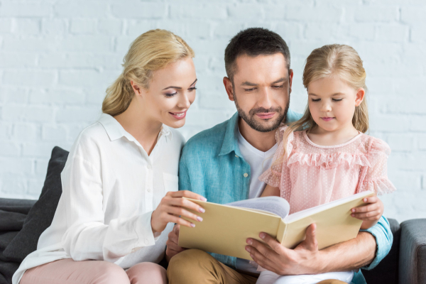 These parents teach reading at home by consistently reading to their daughter on a daily basis